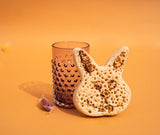 Underlay Violet Hobnail Tumblers on an orange floor surrounded by sweets  